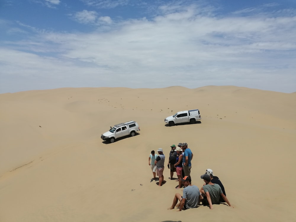 white crew cab pickup truck on desert during daytime