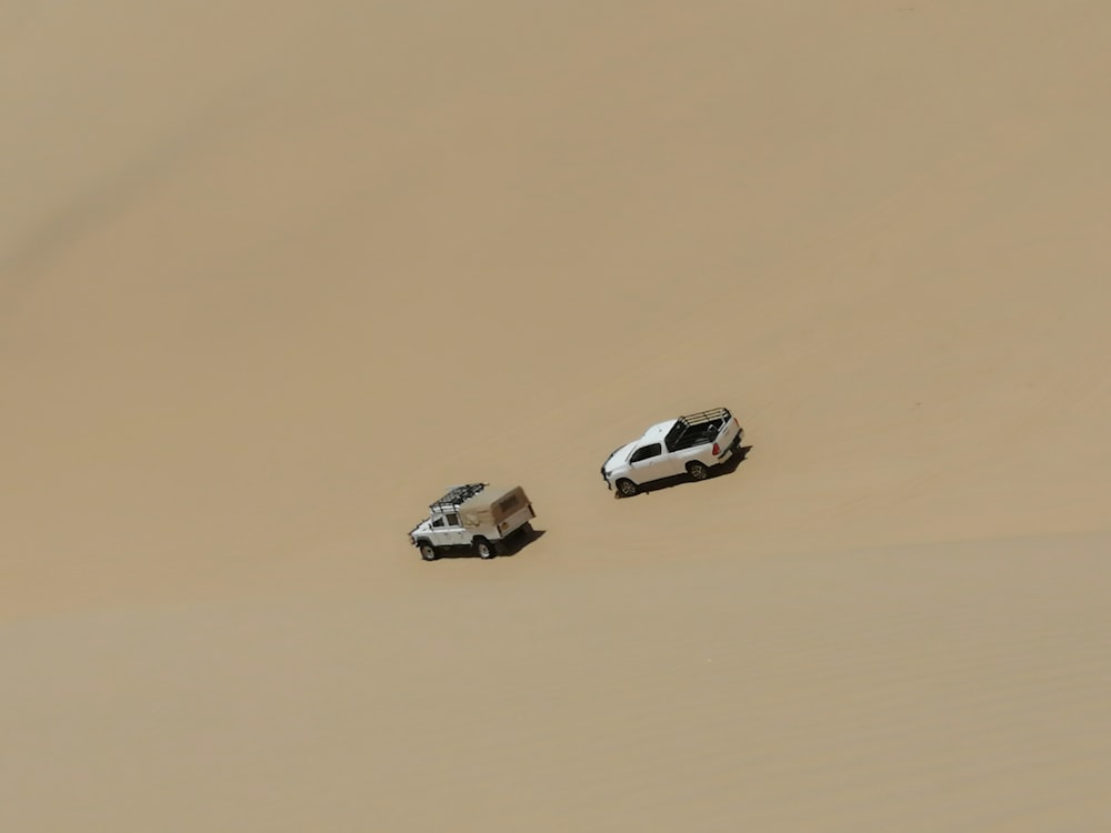 white car on desert during daytime