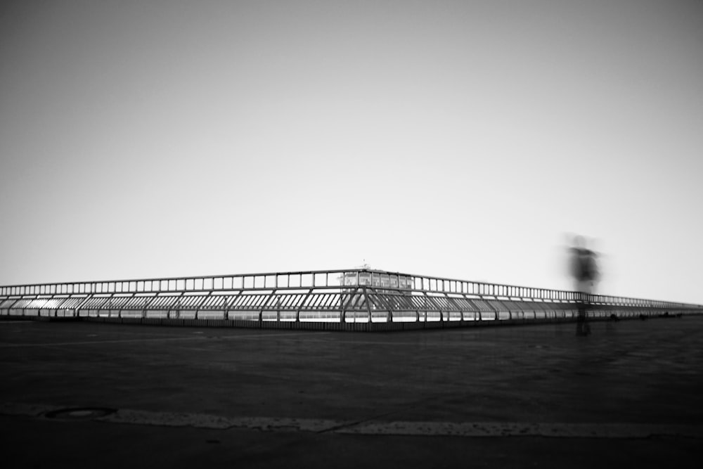 grayscale photo of bridge over water