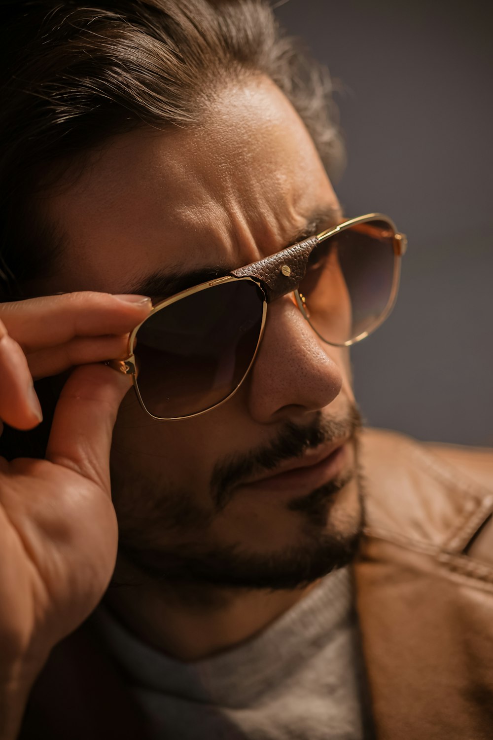man in brown framed sunglasses