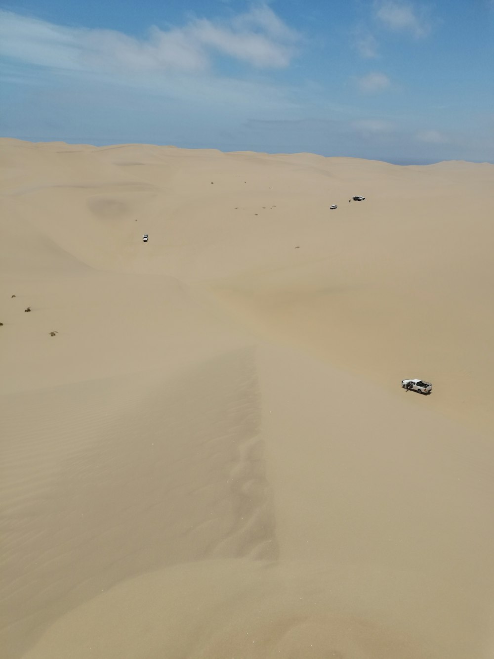 white car on desert during daytime