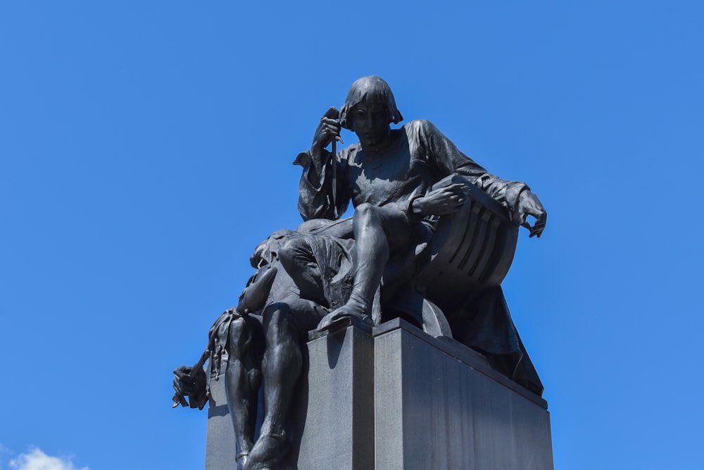 man riding horse statue under blue sky during daytime