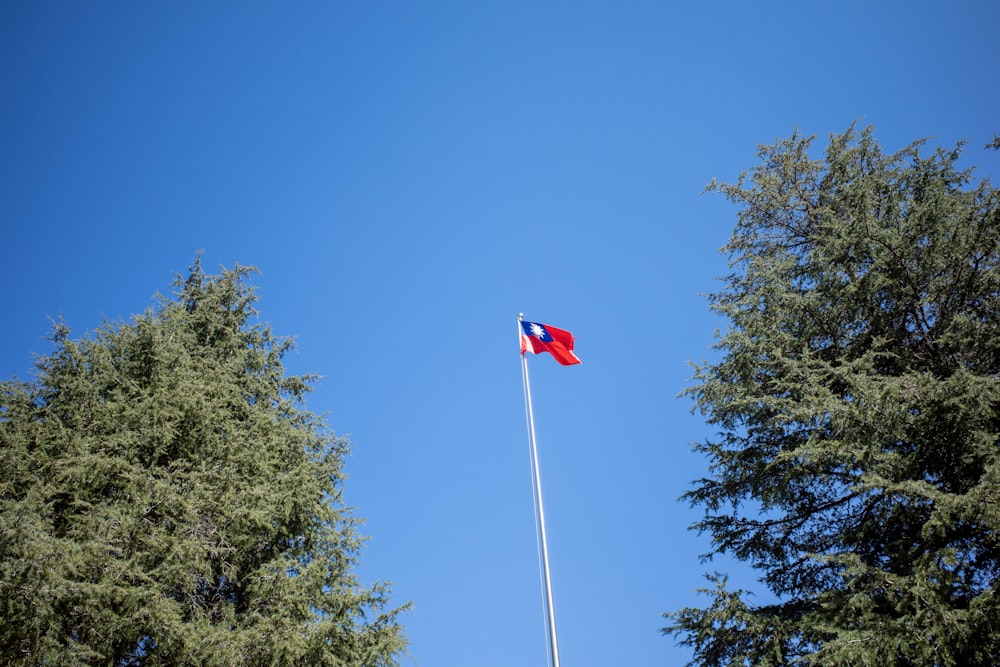 red white and blue flag on pole
