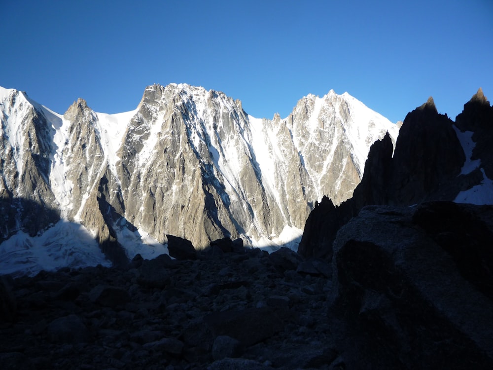 snow covered mountain under blue sky during daytime