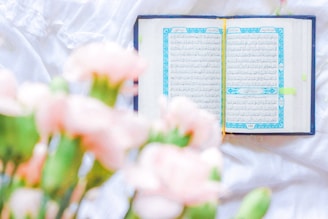 pink and white flowers on book page