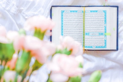 pink and white flowers on book page
