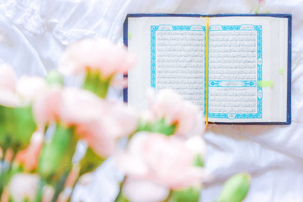 pink and white flowers on book page