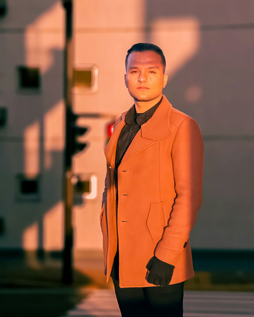 woman in brown blazer standing