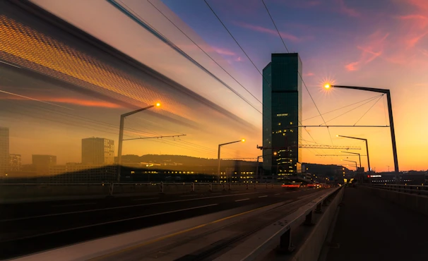 A sleek modern photograph capturing urban architecture at sunset