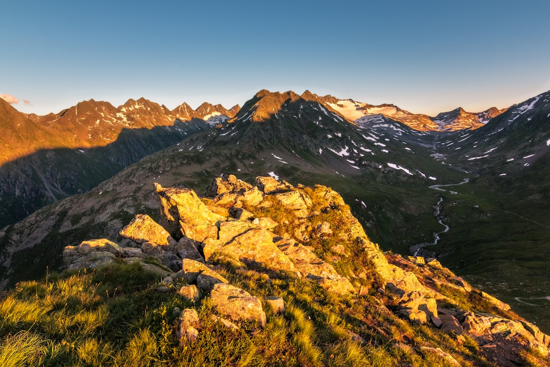 brown and green mountains under blue sky during daytime