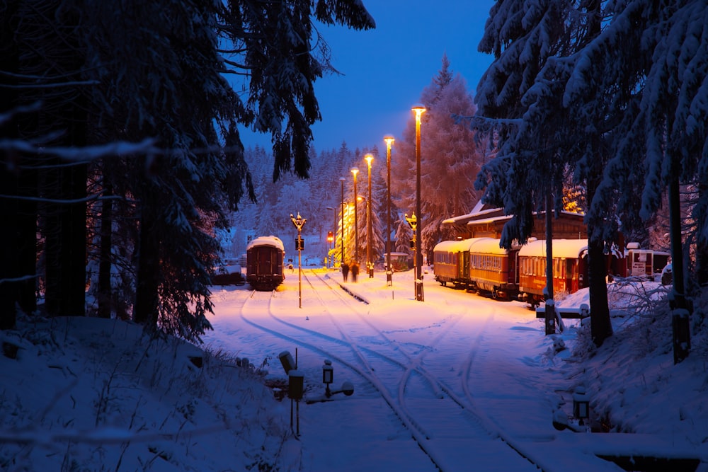 brown wooden house on snow covered ground during daytime