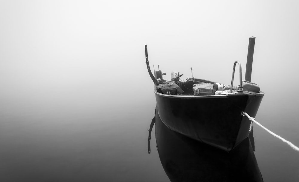 grayscale photo of boat on water