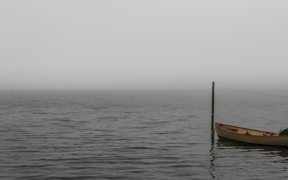 brown boat on sea during daytime