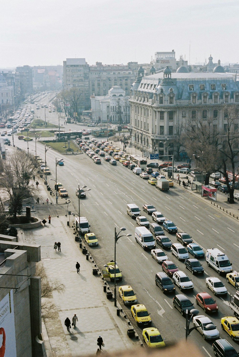 cars parked on street near buildings during daytime