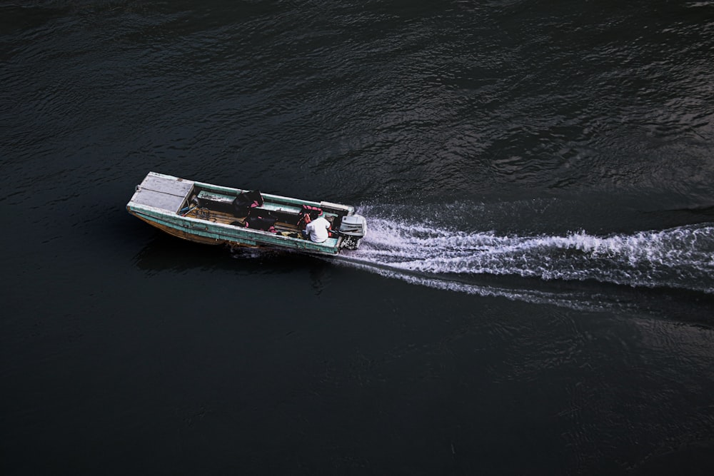 white and red boat on sea during daytime