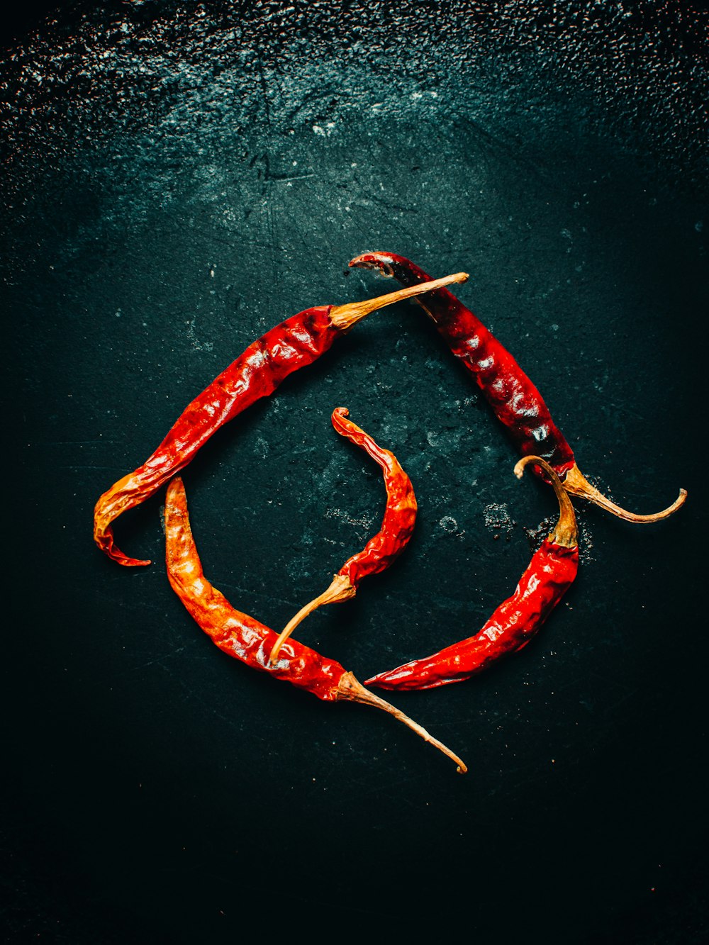 red chili pepper on black surface