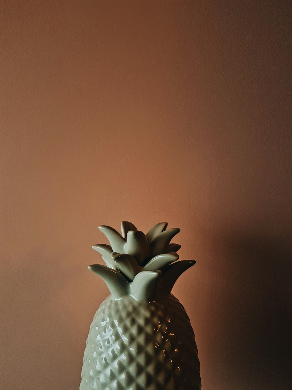 white and black pineapple figurine