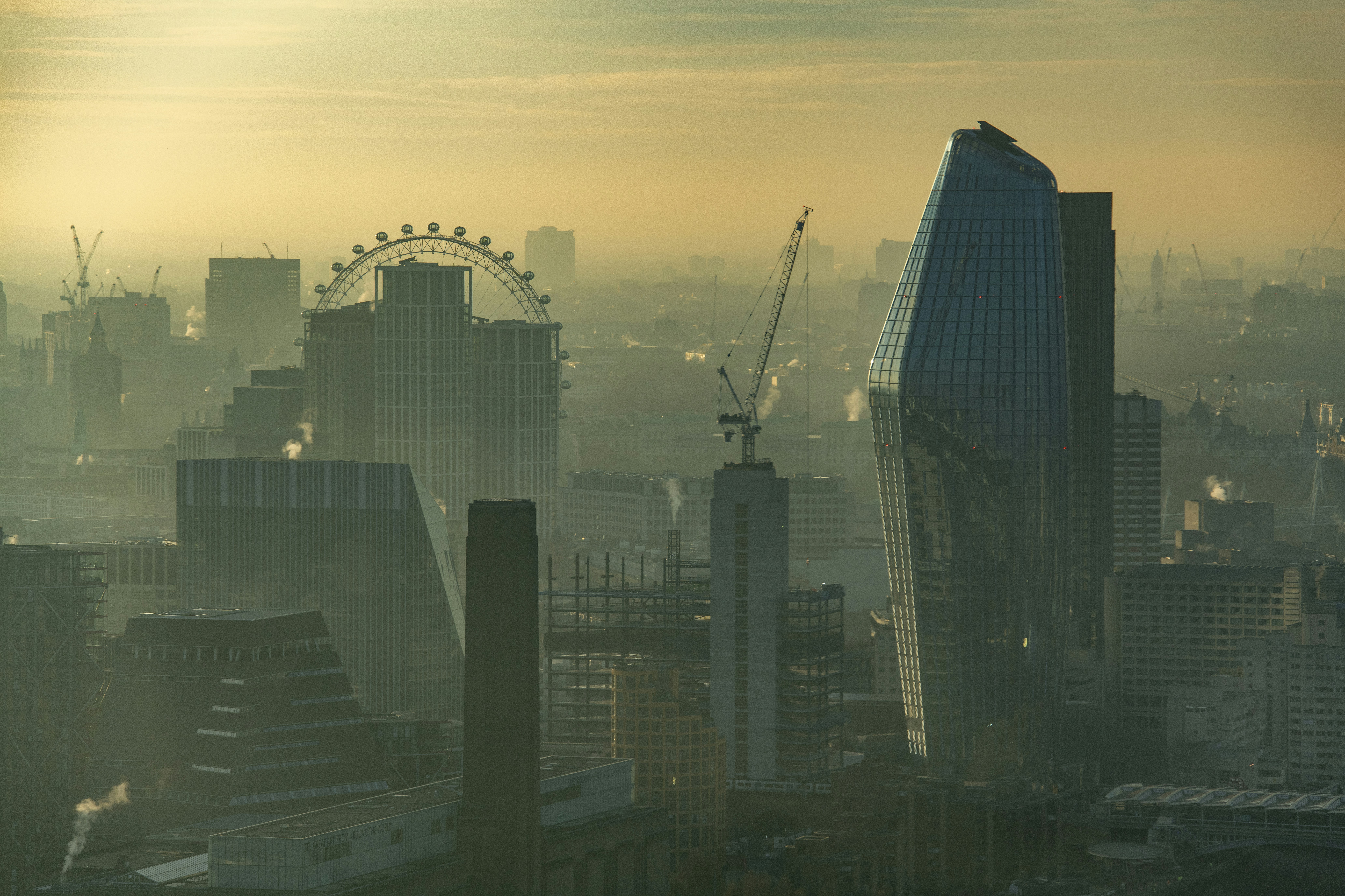 London cityscape with tech buildings in foreground, subtle overlay of a downward-trending stock graph