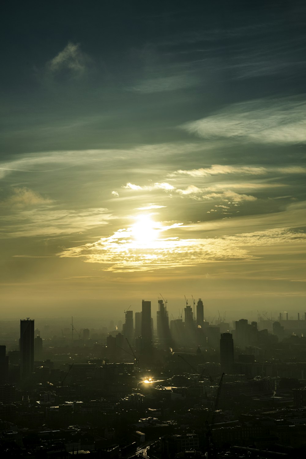 silhouette of city buildings during sunset