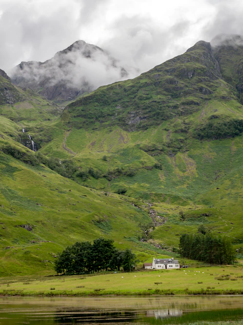 green mountains under white clouds during daytime