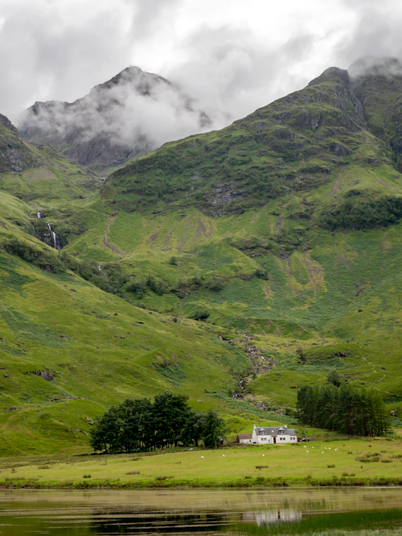 green mountains under white clouds during daytime