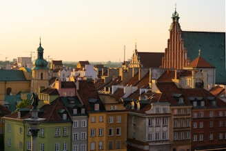 brown and green concrete building under white sky during daytime