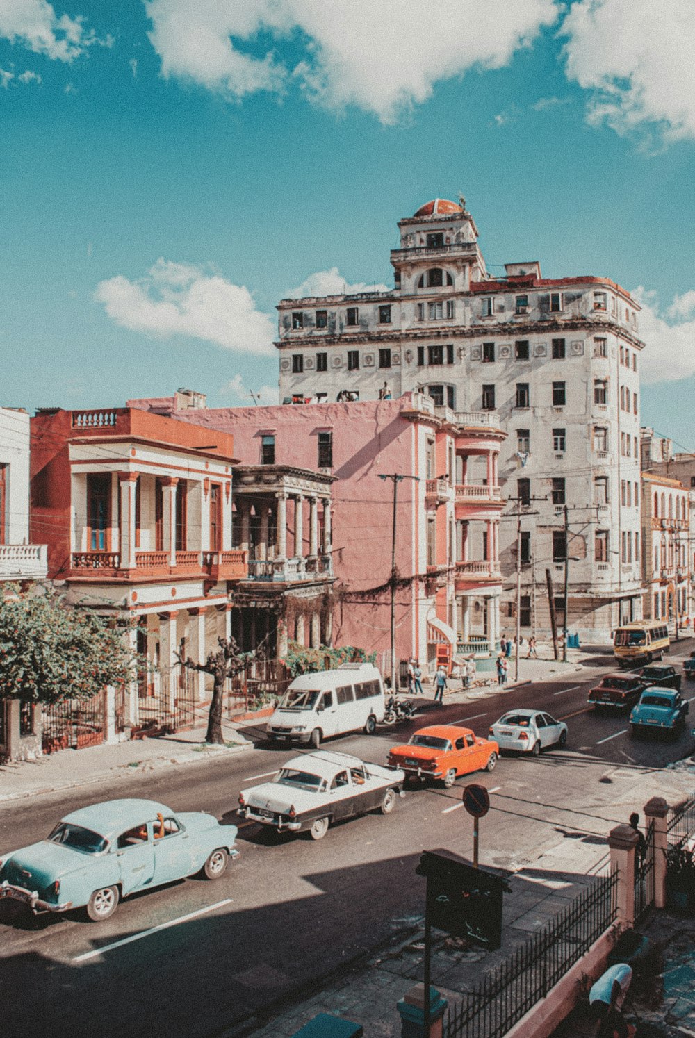 cars parked on street near buildings during daytime