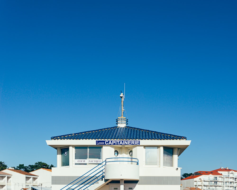 white and brown concrete house under blue sky during daytime