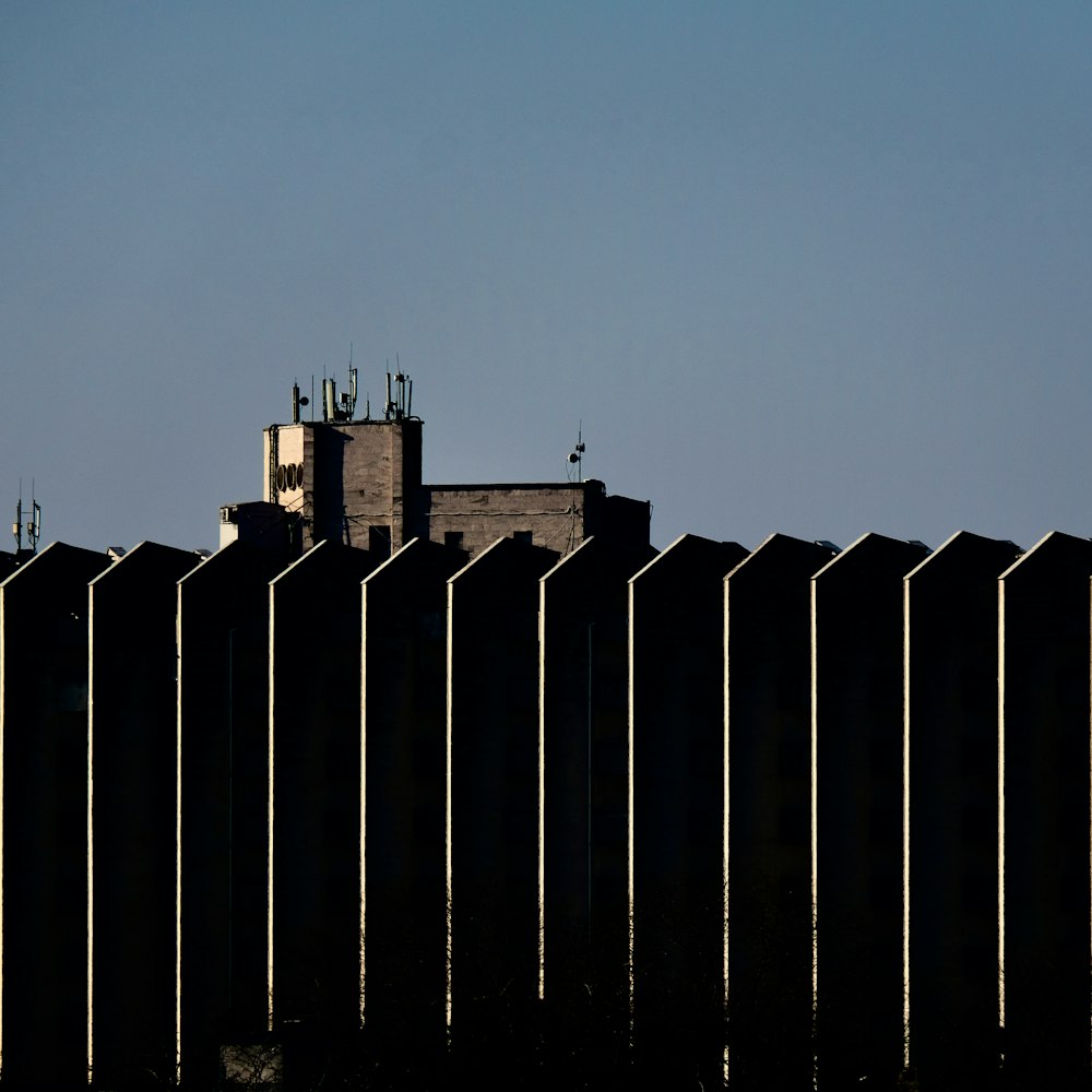 white and black building under gray sky