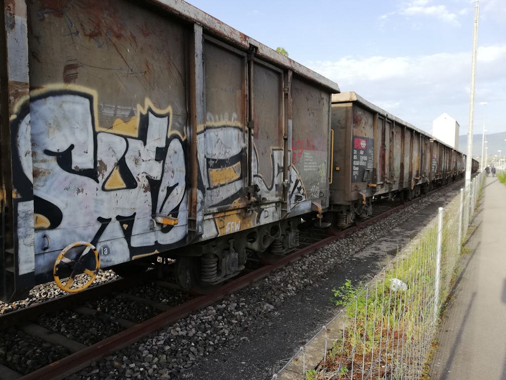 brown and white graffiti on wall