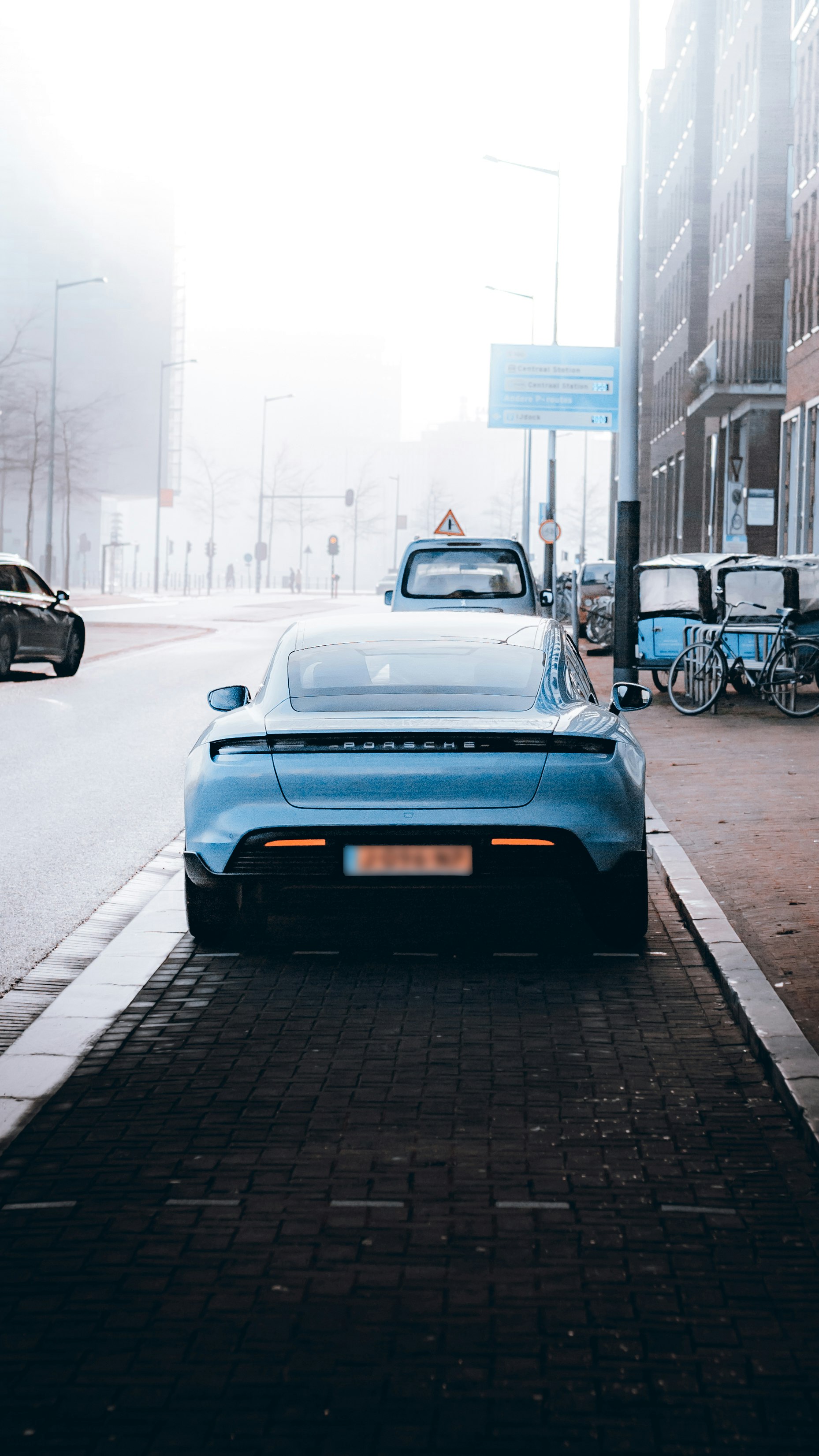 blue car on road during daytime