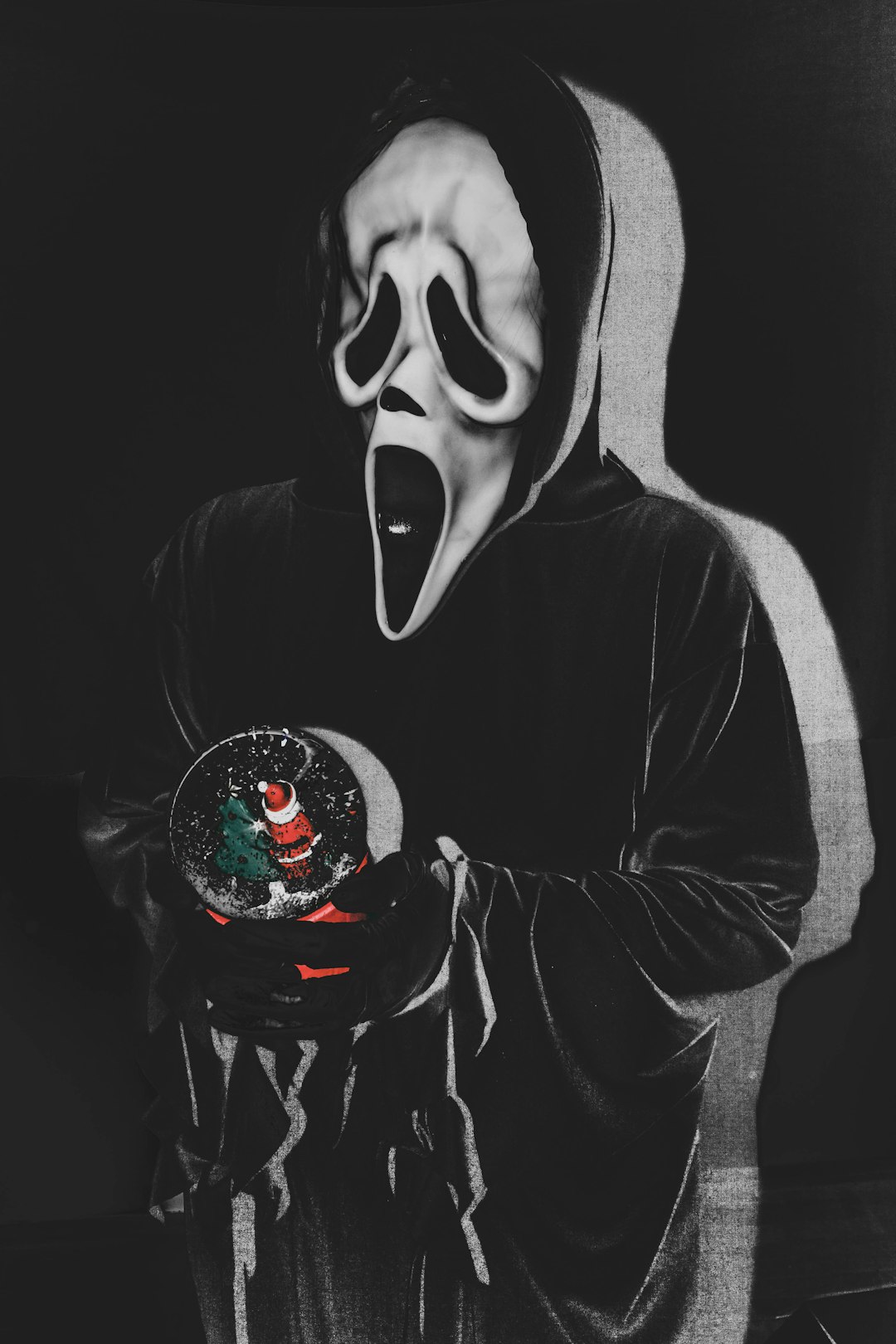 person in black and white hoodie with black and white mask