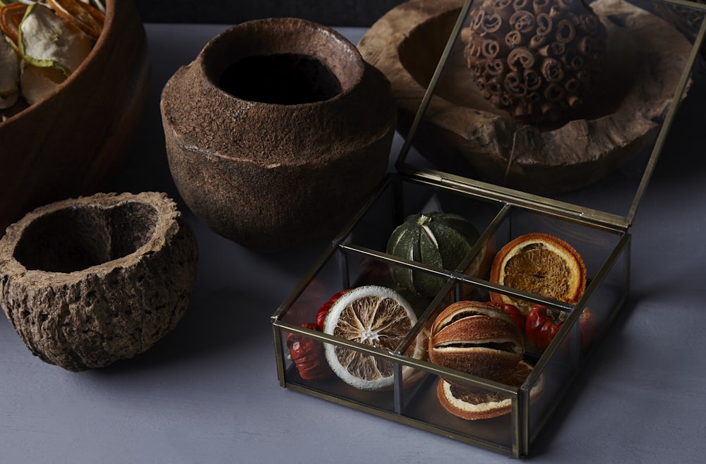 brown clay pot on red and white box