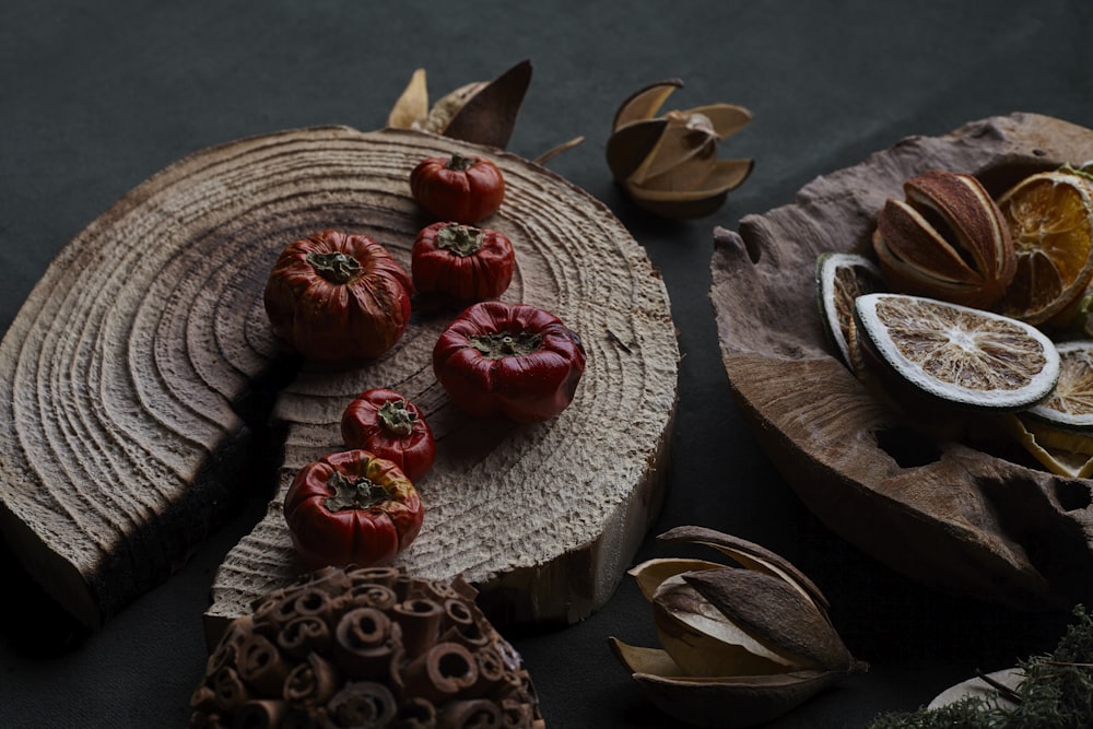 red and green fruit on brown wooden round table