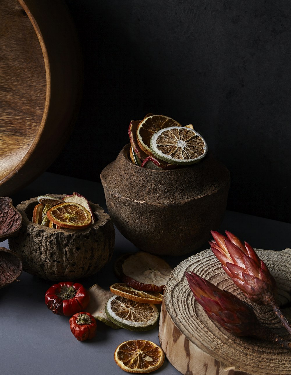 brown and red round fruit on brown wooden round table