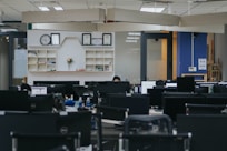 people sitting on chairs inside room