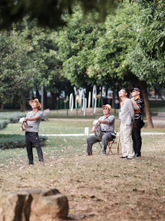 Community members planting trees together in a barangay park