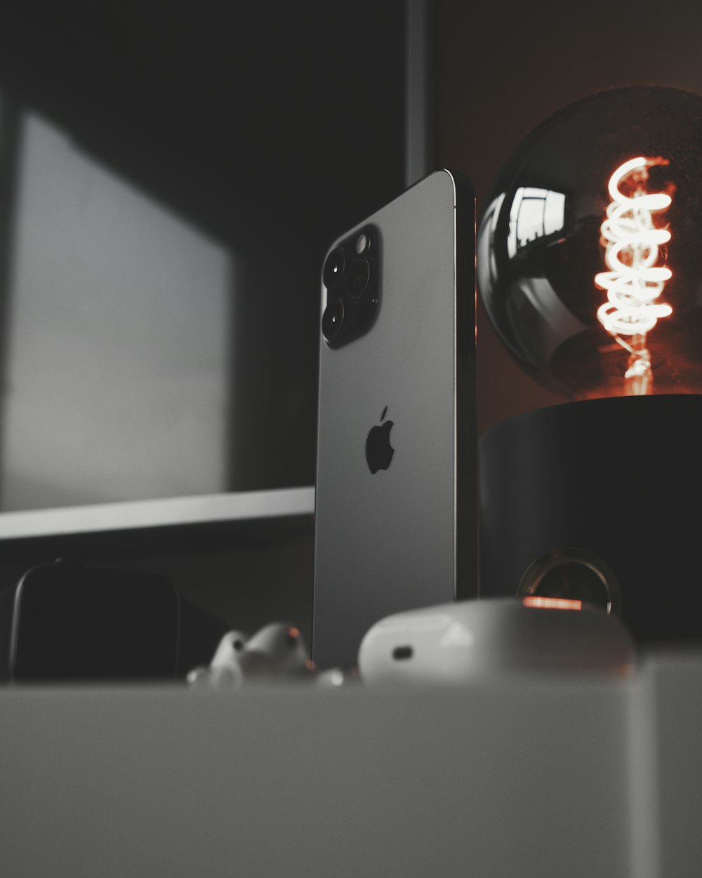 silver iphone 6 on black table