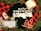 A black t-shirt with 'The Year of the Lockdown 2020' text in white, featuring images of toilet paper rolls and a Santa hat. Surrounding items include a roll of toilet paper, a face mask, candy canes, a red and black checkered Michigan-themed candle, two transparent Christmas ornaments, pine branches, and a rustic rope.