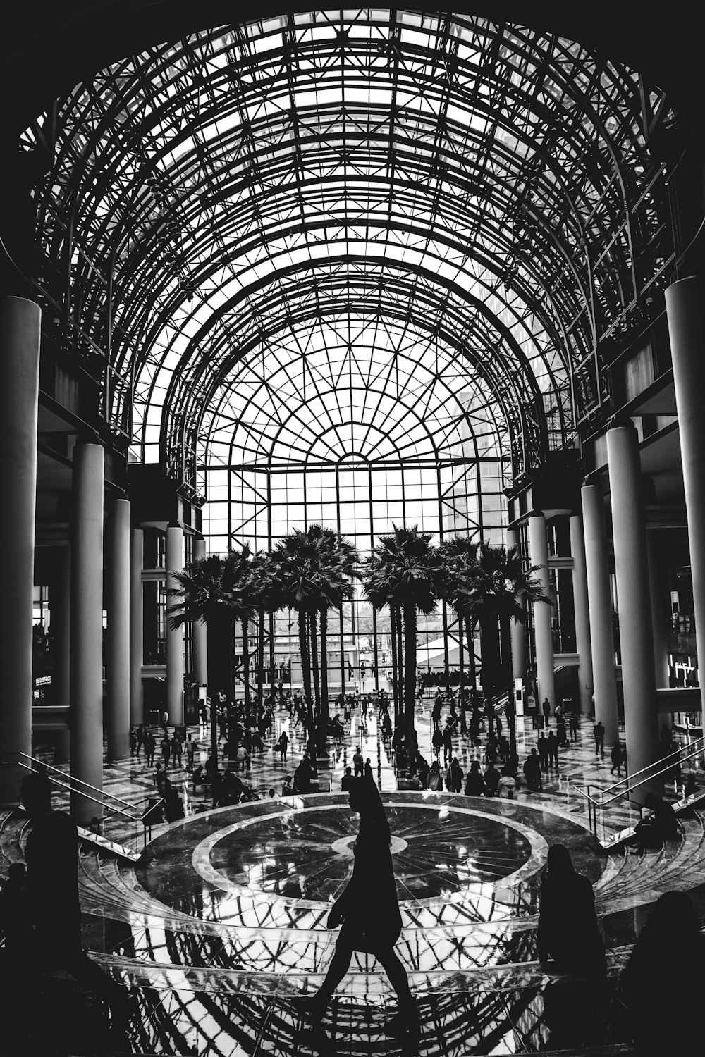 grayscale photo of people inside building