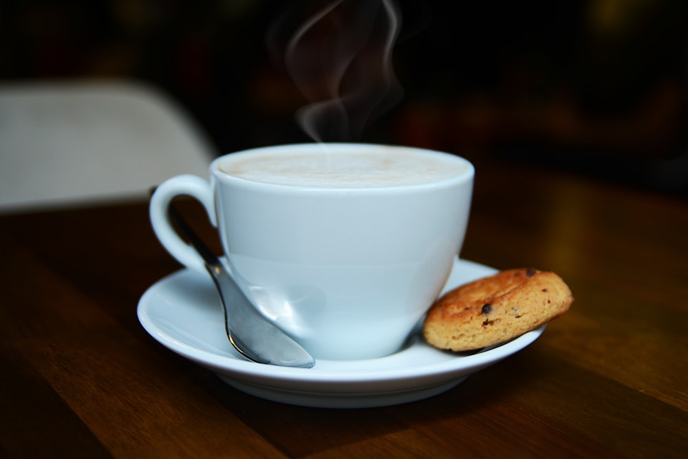 white ceramic cup on white ceramic saucer