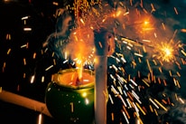 Close-up shot of eco-friendly green crackers emitting minimal smoke during a festival.