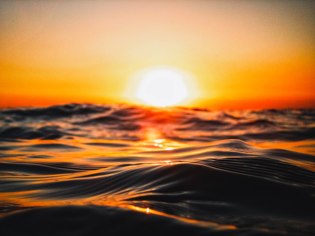 sun setting over the horizon, Sunset over Laguna Beach