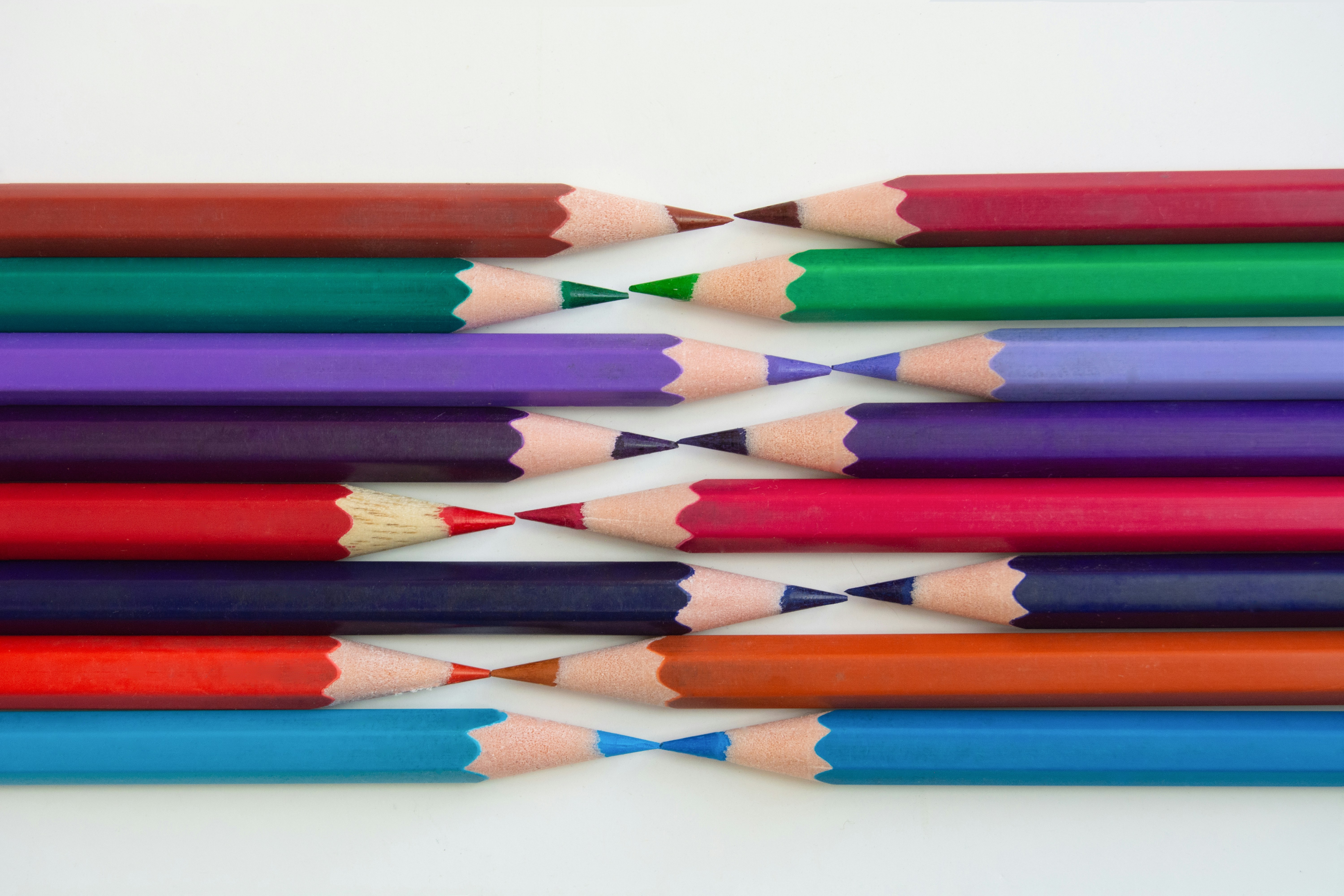 multi color coloring pencils on white surface