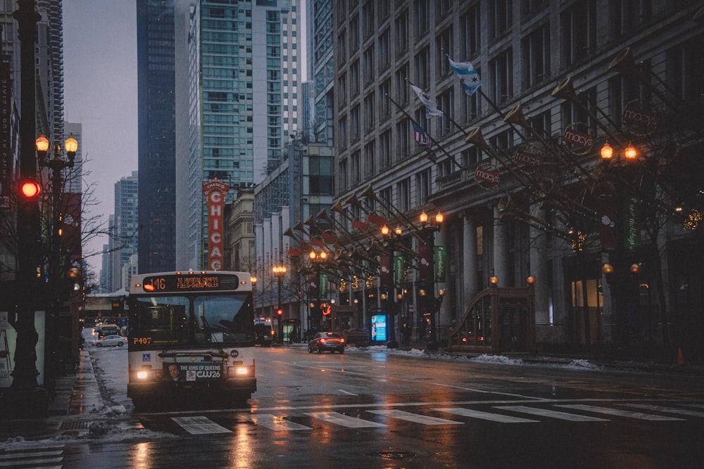 black bus on road during night time