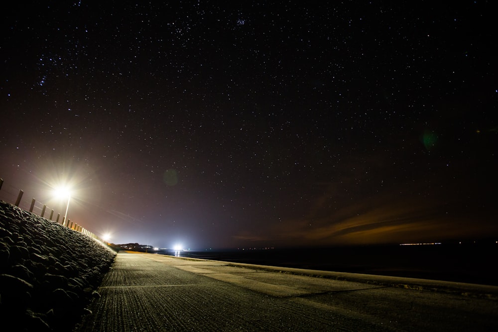 black asphalt road during night time