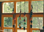 Colorful suncatchers hanging in a bright window
