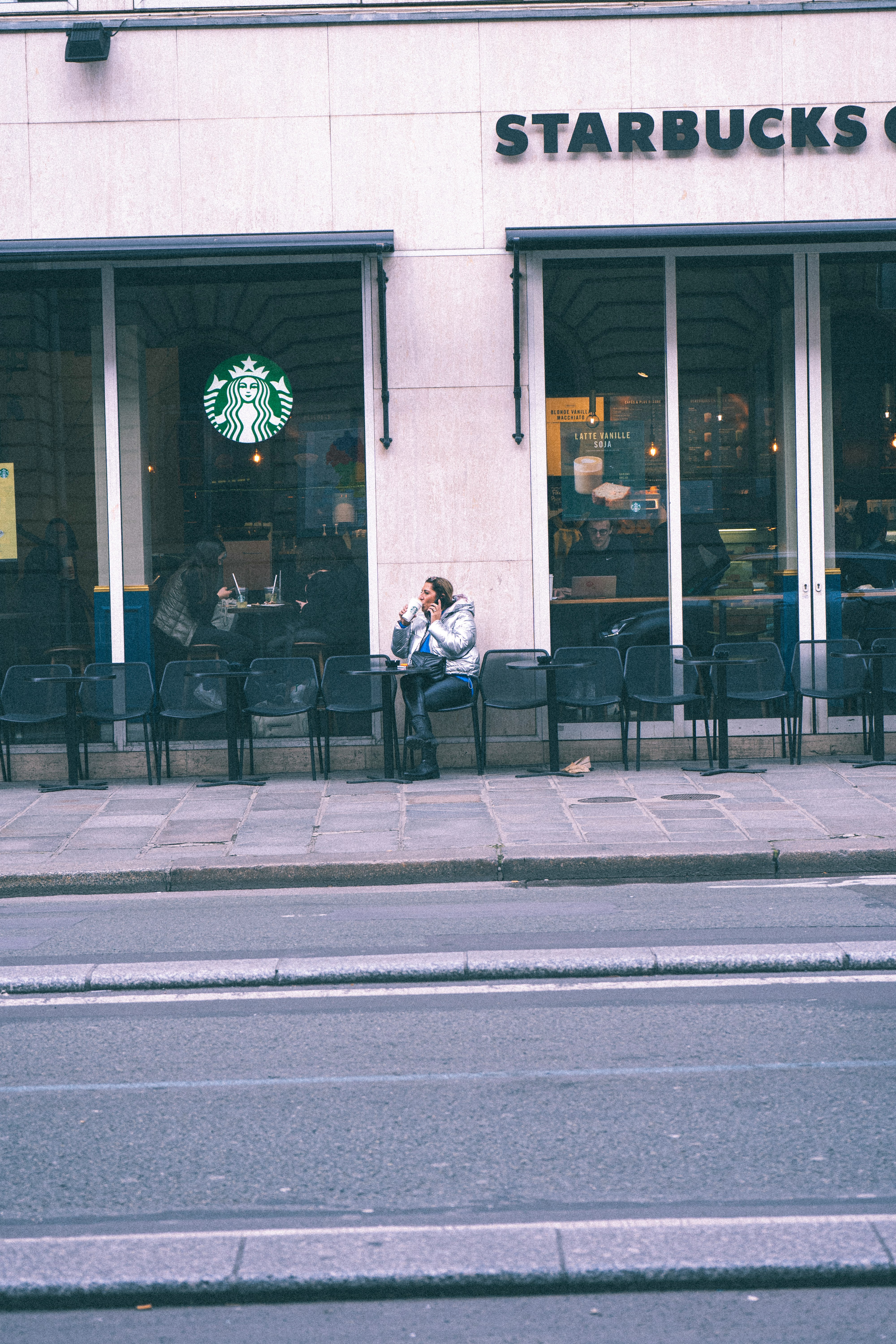 people sitting on bench near building during daytime