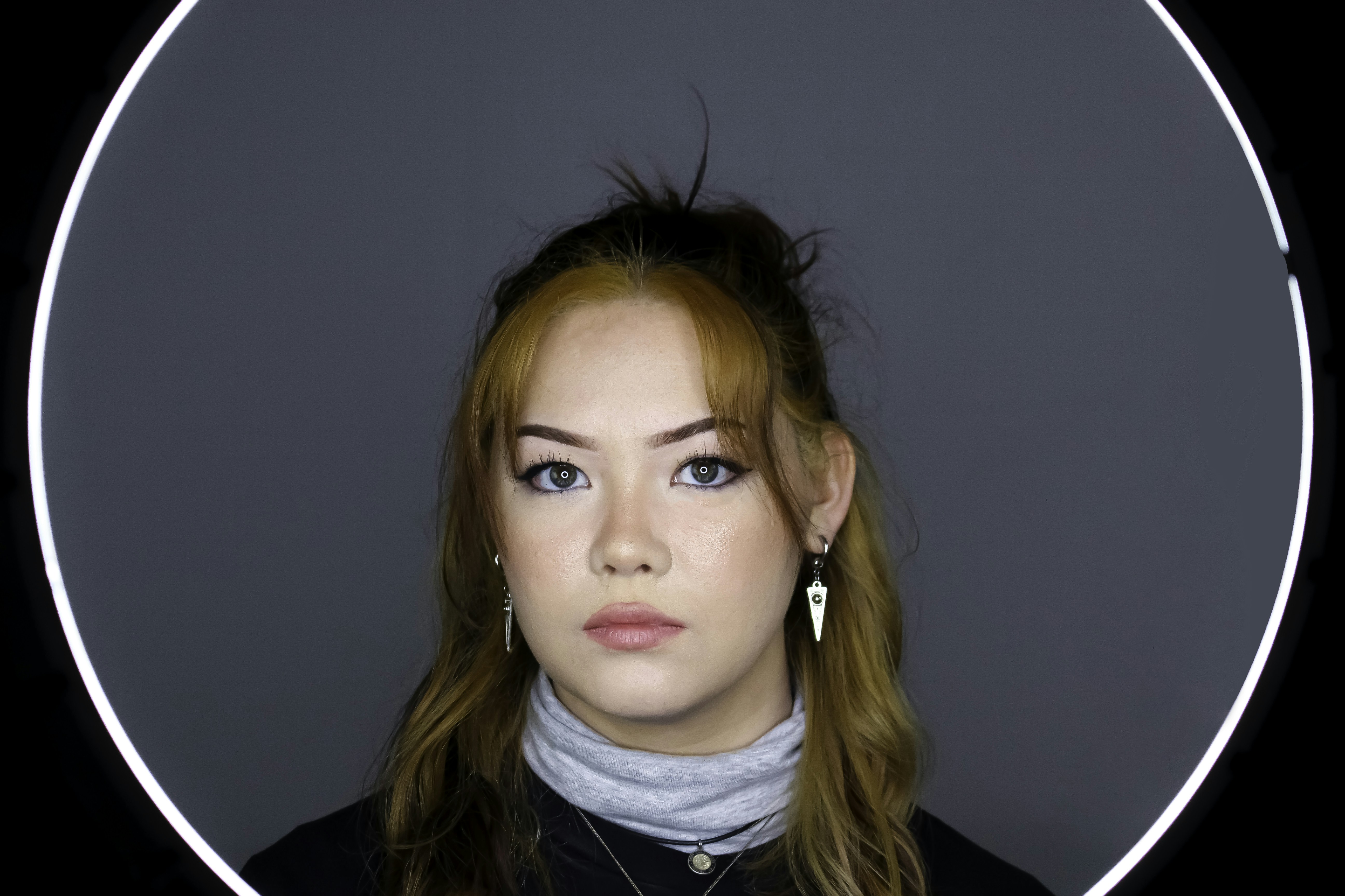 woman in black jacket with white turtle neck shirt (Photo by Mitchell Diboll on Unsplash)