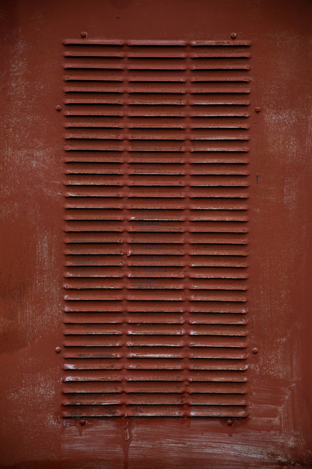 red metal tool box on red surface